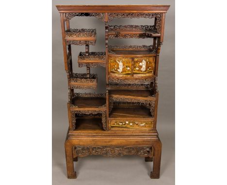 A Japanese Meiji period shibyama and lacquer decorated shodhana cabinetSet with an arrangement of shelves with florally pierc