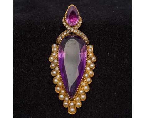 A Victorian amethyst, diamond and seed pearl set unmarked gold articulated pendantThe amethyst pear cut.  6.5 cm long.  CONDI