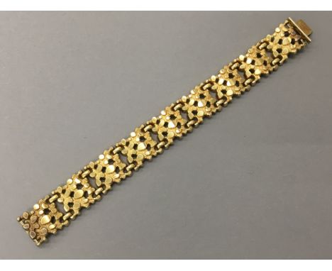A Kordes & Lichtenfels 14 ct gold plated textured braceletOf hinged sectional form, stamped 14 ct RG and maker's mark K & L. 