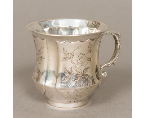 A small Chinese silver mug Of waisted form, decorated with vignettes of various birds and foliage, the base inscribed Frieda 