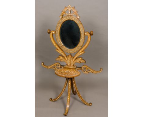 A 19th century Indian marquetry inlaid campaign shaving/washstandThe oval bevelled plate with exotic bird finial, supported o