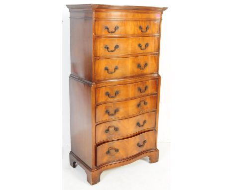 A Queen Anne revival vintage 20th Century walnut serpentine front chest on chest of drawers. Having a flared top with three f