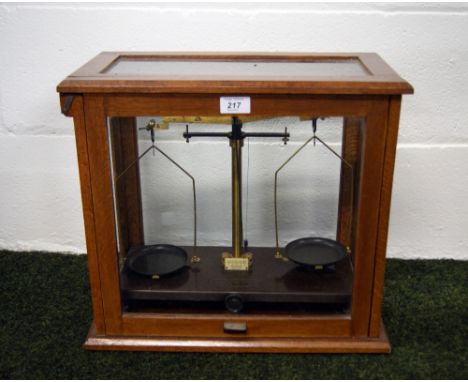 Set of vintage precision scales in an oak case CONDITION REPORT; Available on request. Catalogue descriptions and condition r