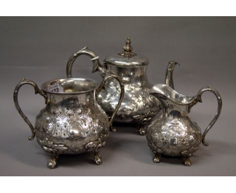 A Victorian silver plated three piece relief decorated tea service CONDITION REPORT; Available on request. Catalogue descript