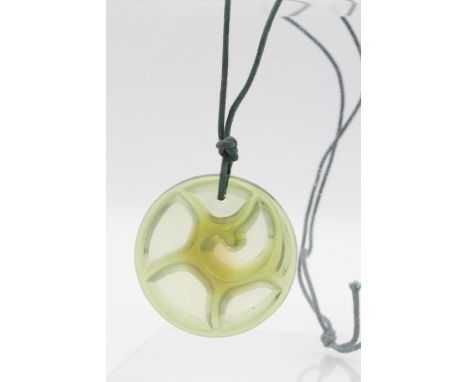 Lalique - a modern green glass stylised tourbillon pendant on cord chain, signed to reverse. Within original box and includin