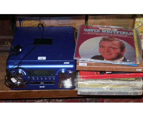 A Seal retro style record player with built in compact disc player / tuner, along with a selection of L.P records country mus