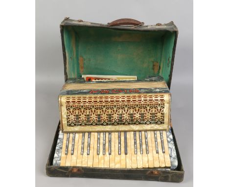 A cased vintage Riosa piano accordian manufactures in Germany, along with accordian sheet music.