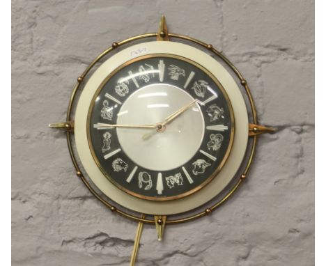 A Metamec motor driven horoscope wall clock.