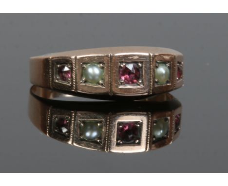 A Victorian 9ct gold garnet and pearl five stone ring, assyaed Birmingham 1894.