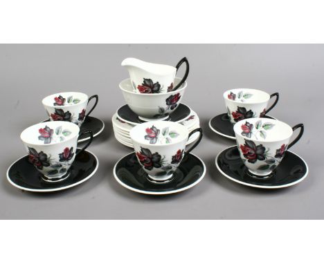 A Royal Albert bone china part tea service in the masquerade design decorated with roses, 20 pieces.