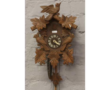 West German manufactured cuckoo clock chiming on a coiled gong.