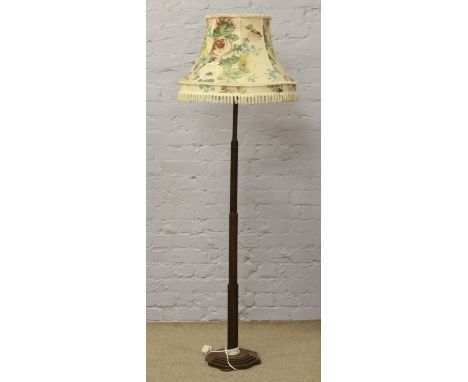 An oak Art Deco standard lamp with floral shade.