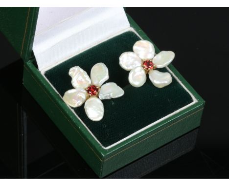 A pair of 9ct gold garnet and freshwater pearl earrings, formed as flower heads.