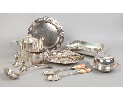 A collection of silver plate to include teapot, salad servers, serving trays, collectors spoons etc.