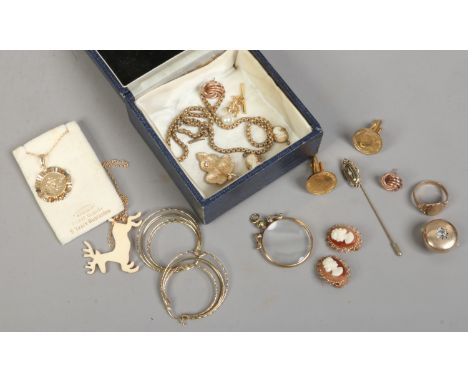 A small blue jewellery box and contents of gold plated jewellery including cameo earrings, pendants, cufflinks etc.