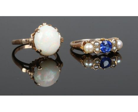 Two 10ct gold dress rings, one set with a large cabochon opal, the other set with cultured pearls and a synthetic blue spinel