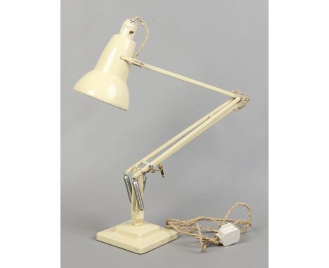 A cream Herbert Terry &amp; Son angle poise lamp with square stepped base.