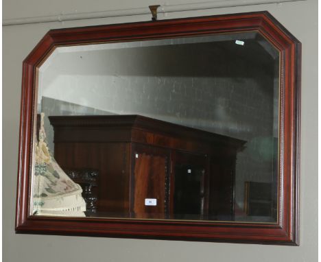 A mahogany framed bevel edge wall mirror.