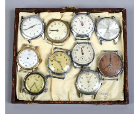 Ten vintage manual watch heads, some with wire lugs.