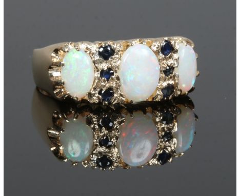 A 9ct gold opal and sapphire 9 stone ring, size O.