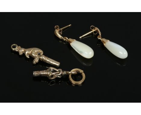 A pair of 9ct gold mother of pearl drop earrings, gross weight 2.22 grams along with two yellow metal watch keys.