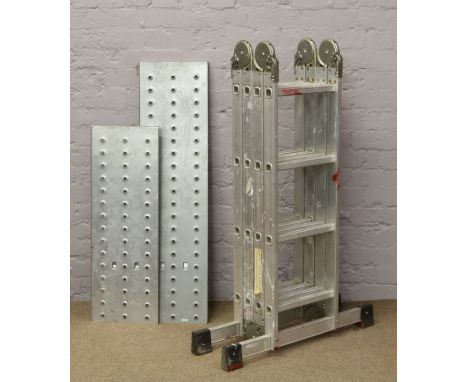 A multi section aluminium extending ladder with two mild steel platforms.