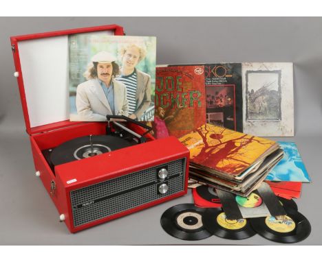 A Fidelity vinyl covered portable record player with BSR turntable, along with a&nbsp;collection of L.P's and single rock rec