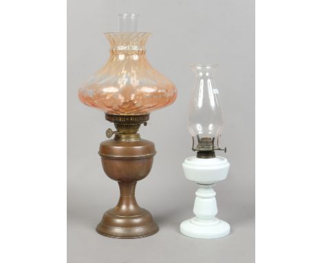 A Victorian copper based oil lamp with amber glass shade along with a milchglas example.
