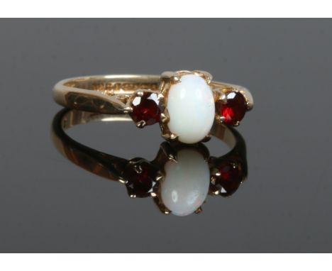 A 9ct gold opal and garnet 3 stone ring, size O.