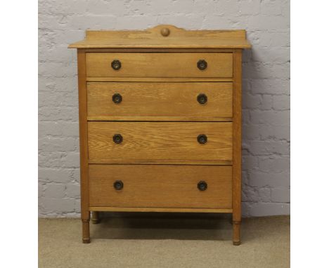 A light oak chest of four drawers.