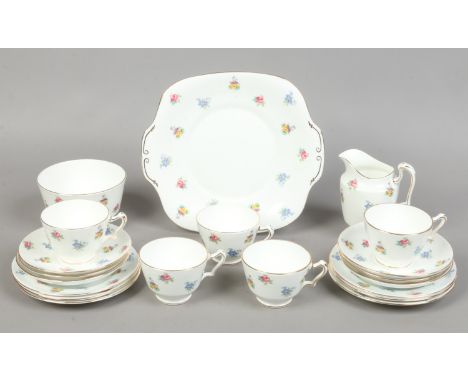 A Crown Staffordshire fine bone china part tea service 20 pieces decorated with flowers.