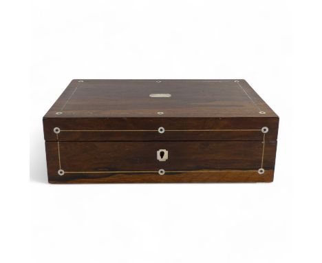 A George IV rosewood and mother-of-pearl inlay writing slope - the fitted interior with inkwell and black leather writing sur