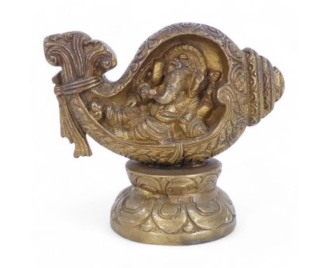 A bronze figure of Ganesha - modelled within a leaf form, raised on a circular lotus leaf base, 13cm high.