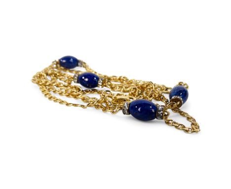 A Christian Dior yellow metal necklace - set with blue and white stones, length 78cm, with branded box.