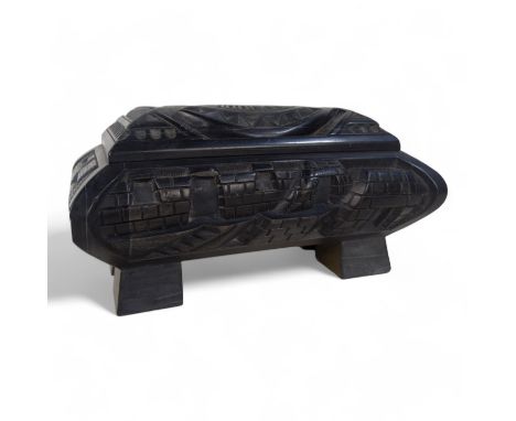 An Anglo Indian 20th century black slate casket - deeply carved with a castellated design and raised on block feet, 19cm wide