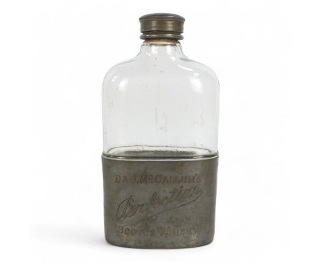 A McCallum's 'Perfection' Whisky hip flask - clear glass with pewter fittings, 15cm high.