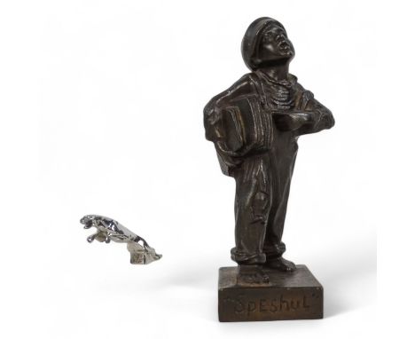 A 20th century cast figure of a boy news vendor - titled 'Speshul', 18cm high, together with a Jaguar car mascot mounted on a