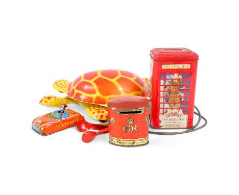 A vintage Mobo tinplate tortoise - decorated in yellow and red, 29cm wide, together with a tinplate car, two money boxes and 