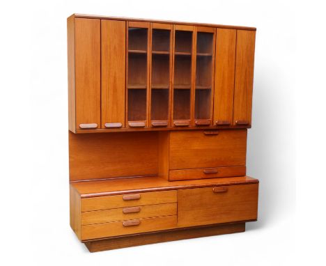 A teak 'Chichester Highboard' side cabinet retailed by White &amp; Newton of Portsmouth - the upper section with an arrangeme