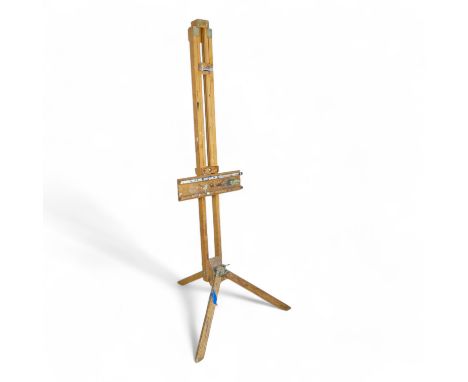 A 20th century beech artist's studio easel - of folding tripod form with some paint transfer, fully adjustable, 178cm high.