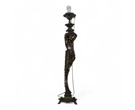 An early 20th century cast metal monoped light - modelled in the form of a cloven hoof caryatid, 107cm high.