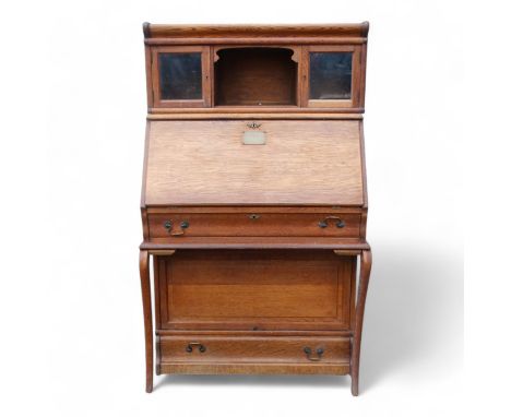 Of First World War Interest - an early 20th century oak Globe Wernicke style bureau bookcase with an arrangement of sectional