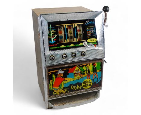 A Modern Automatic company 'Quick Draw' fruit machine - chrome front with Cowboy imagery.