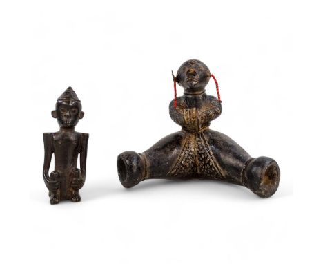 A terracotta Namji fertility figure - seated with legs astride, mounted on an acrylic base, 15cm high, together with another 