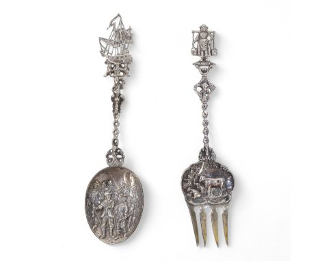 A late 19th century Dutch white metal spoon - with a figural cast bowl and handle with  ship terminal, together with a simila