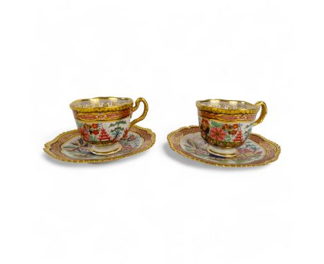 A pair of Worcester Flight Barr &amp; Barr tea cups with saucers - decorated in the Imari style with pagoda bridge pattern. (