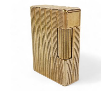 A vintage Dupont Rollagas lighter - gilt metal engine turned, 5cm high.