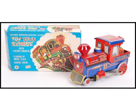 A fabulous vintage 1960's Japanese made Modern Toy Co. ' Toy Town Express ' battery operated tinplate railway locomotive. ' W