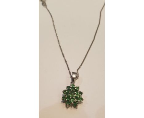 A 9ct white gold ladies necklace and emerald garnet cluster pendant. Total weight 3.4g