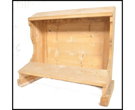 An unusual 19th century country pine eclesiastical pine lecturn/ prayer stand with shaped uprights and central bench - panel